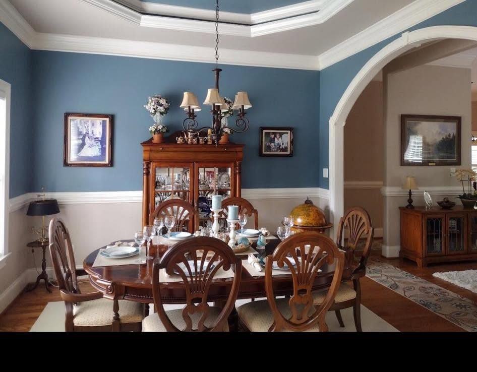 A dining room taken to blue, trim left white by Carolina Superior Painting LLC