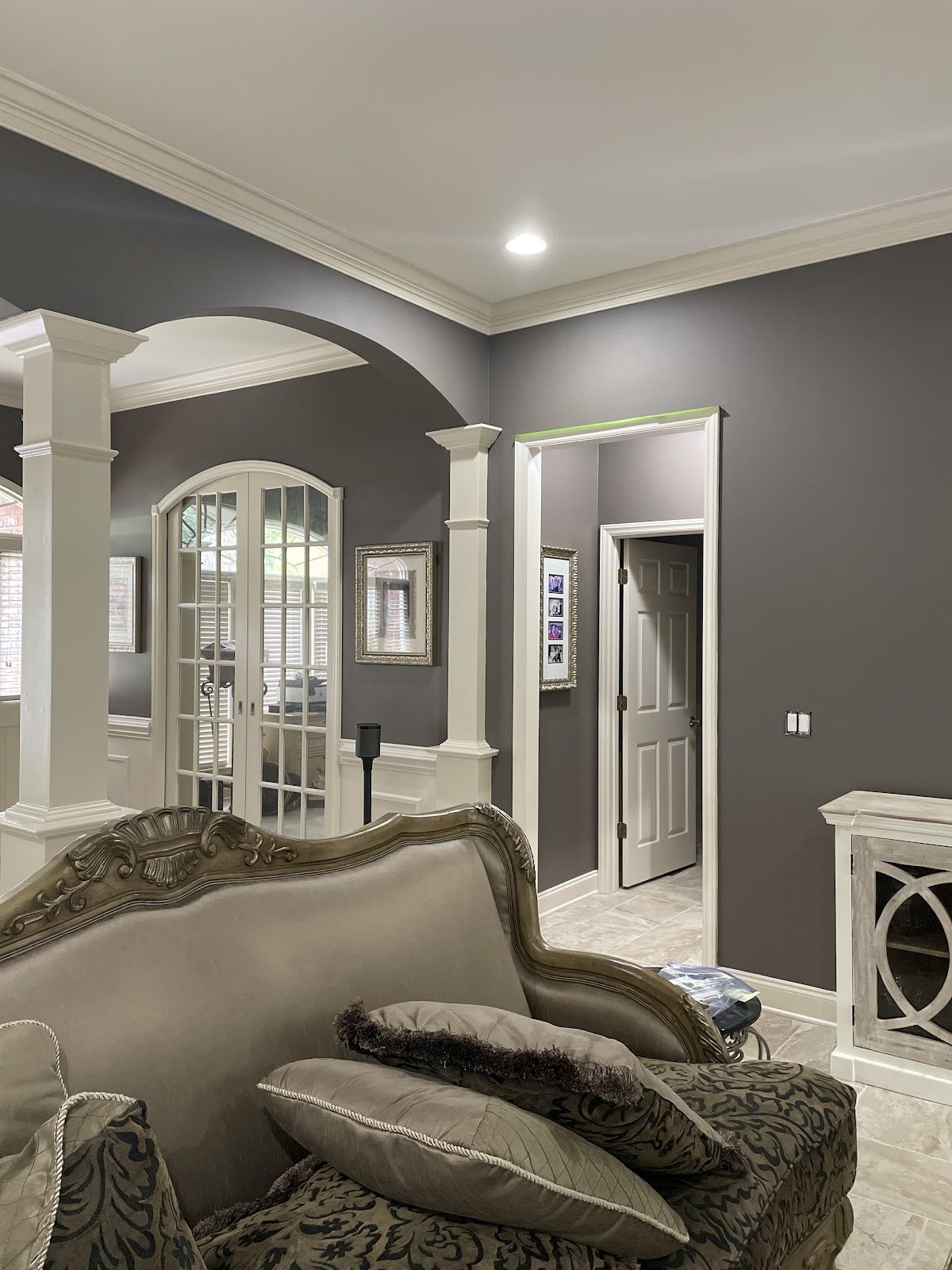Grey walls and white trim, cut in clean around the arch by Carolina Superior Painting LLC